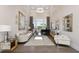 Spacious living room with a comfortable sofa, large windows and a grand piano at 5126 Fairway Oaks Dr, Windermere, FL 34786