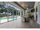 Outdoor dining area with pool and patio view at 5126 Fairway Oaks Dr, Windermere, FL 34786