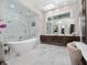 Luxurious bathroom with soaking tub, walk-in shower, and double vanity at 5126 Fairway Oaks Dr, Windermere, FL 34786