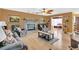Comfortable living room with hardwood floors and stone fireplace at 3105 Pastures Rd, Kissimmee, FL 34746