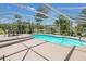 Inviting screened pool area with a spacious deck and seating for relaxing at 3105 Pastures Rd, Kissimmee, FL 34746