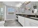 Double vanity bathroom with granite countertops at 3105 Pastures Rd, Kissimmee, FL 34746