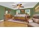 Spacious main bedroom with a king-size bed and plush seating at 3105 Pastures Rd, Kissimmee, FL 34746