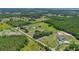 Aerial view of property and surrounding rural landscape at 3105 Pastures Rd, Kissimmee, FL 34746