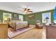 Spacious bedroom with hardwood floors and ceiling fan at 3105 Pastures Rd, Kissimmee, FL 34746