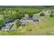 Aerial view of house with pool, cabana, and expansive lot at 3105 Pastures Rd, Kissimmee, FL 34746