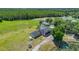 Aerial view of house, pool, and surrounding landscape at 3105 Pastures Rd, Kissimmee, FL 34746