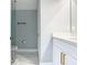 Modern bathroom with white cabinets and marble tile at 133 Andalusia Loop, Davenport, FL 33837