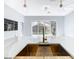Kitchen island with built-in sink and a view of the backyard pool at 133 Andalusia Loop, Davenport, FL 33837
