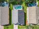 Aerial view of three homes with pools in a residential area at 133 Andalusia Loop, Davenport, FL 33837