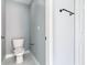 Simple bathroom with toilet and marble flooring at 133 Andalusia Loop, Davenport, FL 33837