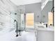Elegant bathroom with marble shower and soaking tub at 133 Andalusia Loop, Davenport, FL 33837