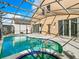Relaxing screened-in pool and spa area at 133 Andalusia Loop, Davenport, FL 33837