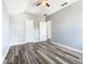 Spacious bedroom with wood-look floors and ample closet space at 133 Andalusia Loop, Davenport, FL 33837
