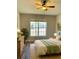 Bedroom with wood-look floors, large window, and ceiling fan at 2181 Cypress Bay Blvd, Kissimmee, FL 34743