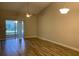 Spacious living room with hardwood floors and sliding door to patio at 2181 Cypress Bay Blvd, Kissimmee, FL 34743