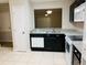 Kitchen with granite countertops and dark wood cabinets at 2181 Cypress Bay Blvd, Kissimmee, FL 34743