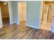 Bedroom with hardwood floors and access to bathroom and closet at 2181 Cypress Bay Blvd, Kissimmee, FL 34743