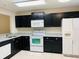 Kitchen with granite countertops and dark wood cabinets at 2181 Cypress Bay Blvd, Kissimmee, FL 34743