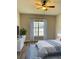 Bright bedroom with hardwood floors and large window at 2181 Cypress Bay Blvd, Kissimmee, FL 34743