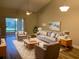 Living room with vaulted ceiling, hardwood floors, and comfy seating at 2181 Cypress Bay Blvd, Kissimmee, FL 34743