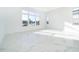 Sunlit living room with water view and marble floors at 9752 Laurel Berry Dr, Orlando, FL 32827