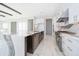 Modern kitchen with white cabinets, marble countertops, and island at 9752 Laurel Berry Dr, Orlando, FL 32827