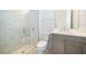Modern bathroom with walk-in shower and gray vanity at 9752 Laurel Berry Dr, Orlando, FL 32827