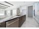 Modern kitchen with white cabinets, marble countertops, and island at 9752 Laurel Berry Dr, Orlando, FL 32827