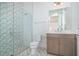 Elegant bathroom featuring a patterned shower and updated vanity at 9752 Laurel Berry Dr, Orlando, FL 32827