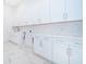 Bright laundry room with white cabinets and quartz countertops at 9752 Laurel Berry Dr, Orlando, FL 32827