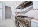 Modern kitchen with stainless steel appliances and marble backsplash at 9752 Laurel Berry Dr, Orlando, FL 32827