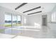 Spacious living room with marble floors, water views, and high ceilings at 9752 Laurel Berry Dr, Orlando, FL 32827