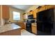 Well-equipped kitchen with granite countertops and black appliances at 2716 Bushman Dr, Kissimmee, FL 34746