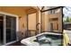 Private hot tub with seating area on patio at 2716 Bushman Dr, Kissimmee, FL 34746