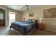 Main bedroom with balcony access and ensuite bathroom at 2716 Bushman Dr, Kissimmee, FL 34746