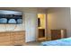 Bedroom with large TV, dresser and en-suite bathroom at 2716 Bushman Dr, Kissimmee, FL 34746