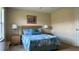 Cozy bedroom with full-size bed and large window at 2716 Bushman Dr, Kissimmee, FL 34746