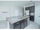 Kitchen island with granite countertop and double sink at 10556 Salt Grove St, Orlando, FL 32824