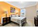 Bedroom with a full-size bed and accent wall at 3425 Halsway Dr, Orlando, FL 32824