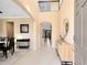 Bright foyer with tile floors, a console table and view to dining room and living areas at 3425 Halsway Dr, Orlando, FL 32824