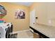 Laundry room with washer, dryer, built-in counter and storage at 3425 Halsway Dr, Orlando, FL 32824