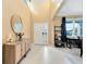 Light-filled foyer with console table and view into living room at 3425 Halsway Dr, Orlando, FL 32824