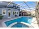 Large screened pool with spa and adjacent patio at 3425 Halsway Dr, Orlando, FL 32824