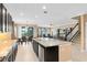 Open kitchen with large island, stainless steel appliances and view of Gathering room at 3425 Halsway Dr, Orlando, FL 32824