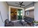 Relaxing covered patio with seating area, adjacent to the dining room at 3425 Halsway Dr, Orlando, FL 32824