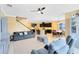 Open living area with comfortable seating and views into the kitchen and dining area at 3425 Halsway Dr, Orlando, FL 32824
