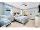 Bedroom with large bed, seating area and ensuite bath at 3425 Halsway Dr, Orlando, FL 32824