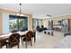 Open concept dining and Gathering room with pool view, and access to kitchen at 3425 Halsway Dr, Orlando, FL 32824