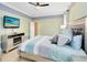 King sized bedroom with ensuite bathroom and fireplace at 3425 Halsway Dr, Orlando, FL 32824